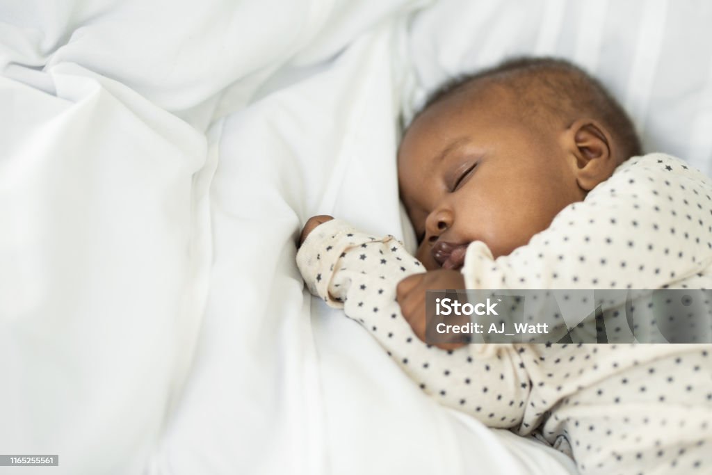 Meet our little one Cropped shot of a baby girl sleeping peacefully at home Baby - Human Age Stock Photo