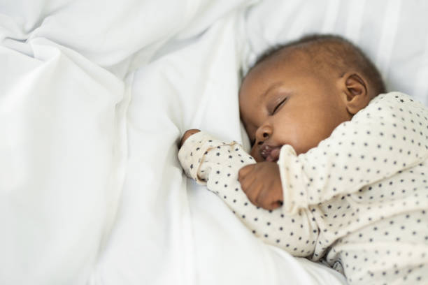 Meet our little one Cropped shot of a baby girl sleeping peacefully at home sleeping photos stock pictures, royalty-free photos & images