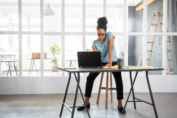 istock African businesswoman working in the office and using laptop 1165255949