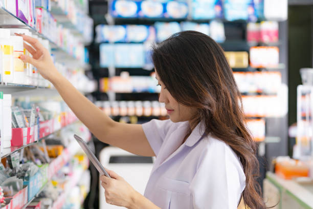 istock Asian female pharmacist in the pharmacy 1165256002