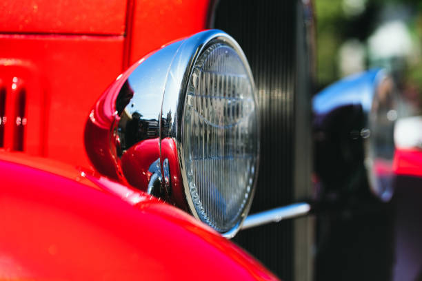 istock Headlight of a vintage red car 1165258081