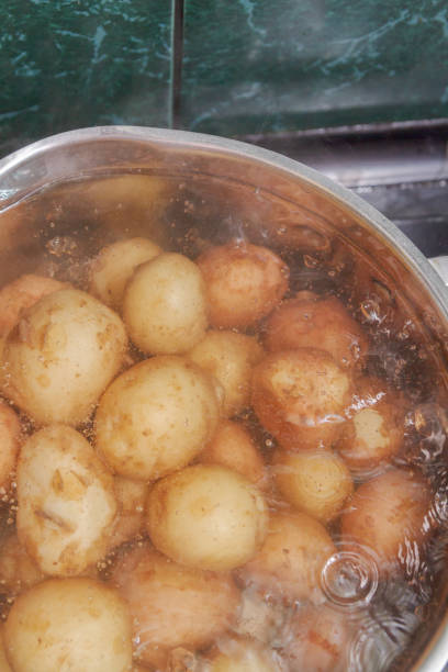istock New potatoes boil in their skins in a saucepan 1165258174