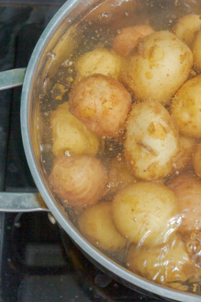 istock New potatoes boil in their skins in a saucepan 1165258190