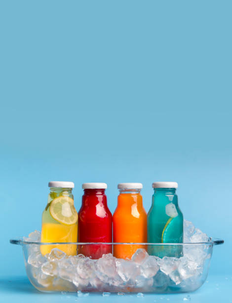 istock Set of different detox drinks with ice on light blue background 1165259425
