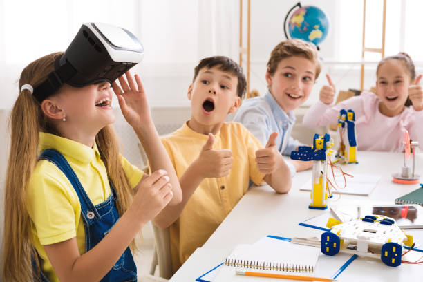istock School children playing with vr glasses in school 1165260242