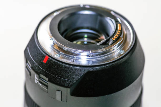 istock Rear end of a camera lens with electronic contact points in macro view 1165260301