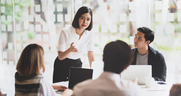 istock Businesswoman explaining her strategy to her team members 1165260587