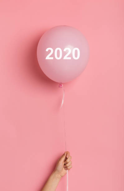 istock Helium balloon with white text on pink background for gift card 1165260821