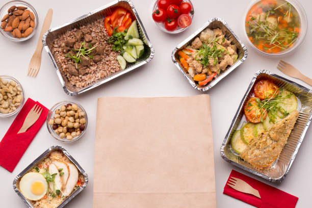 istock Paper bag for helthy food delivering with take away boxes 1165261777