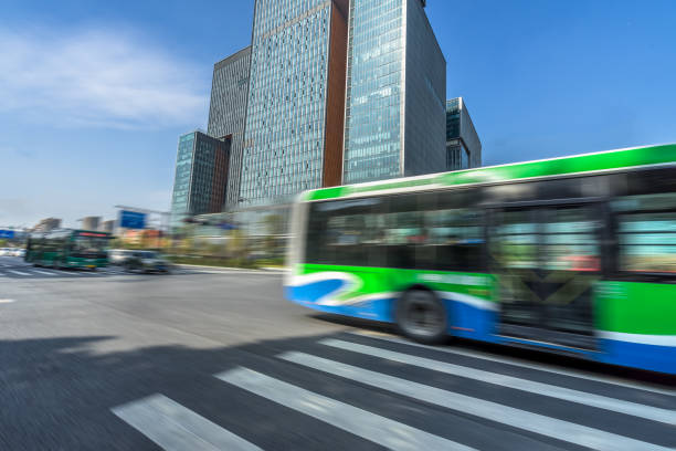 istock blurred empty urban road and modern buildings at a sunny day, china 1165262196