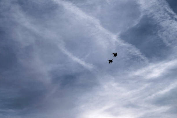 istock fighters are flying in the sky 1165263375