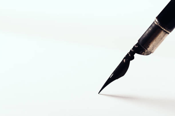 istock diary with fountain pen on white close-up 1165263919