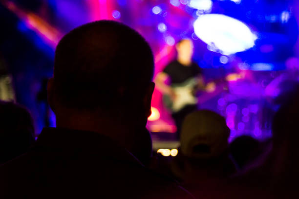 istock Concert arena with fans clapping 1165271733