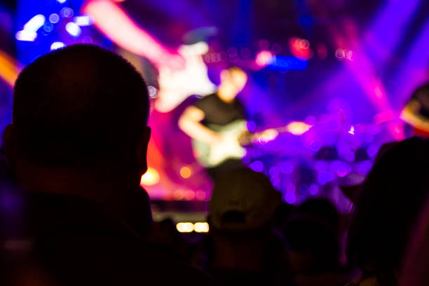 istock Concert arena with fans clapping 1165272075