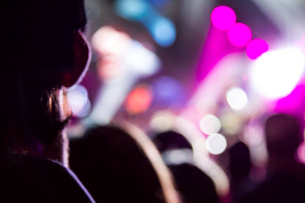 istock Concert arena with fans clapping 1165272079