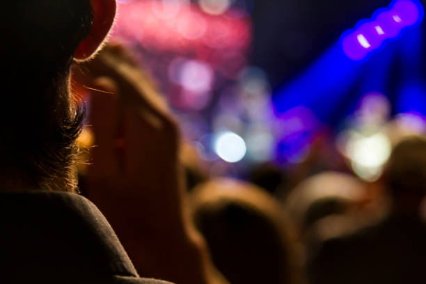 istock Concert arena with fans clapping 1165272672