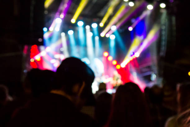 istock Concert arena with fans clapping 1165272960