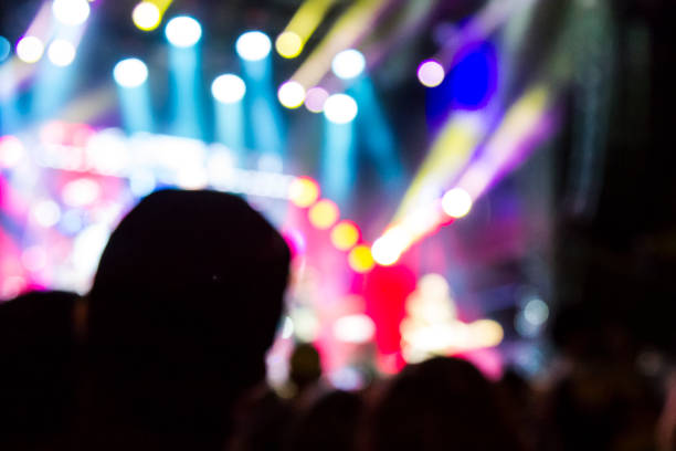 istock Concert arena with fans clapping 1165273071