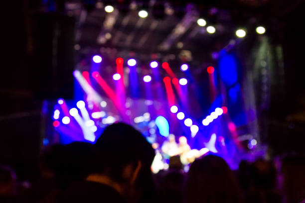 istock Concert arena with fans clapping 1165273966