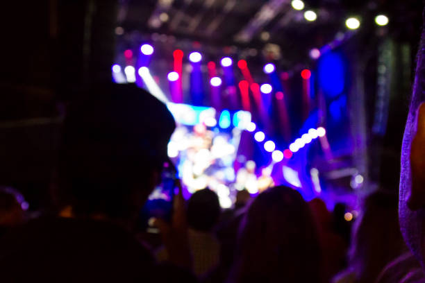 istock Concert arena with fans clapping 1165273971