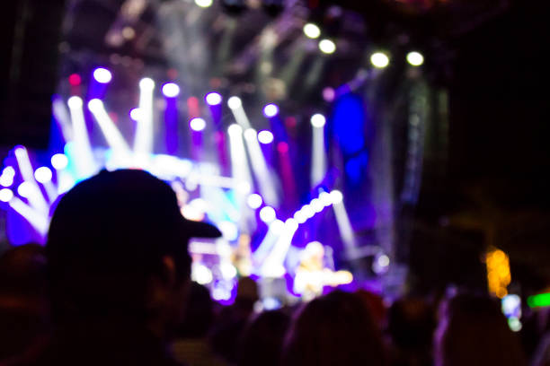 istock Concert arena with fans clapping 1165274259
