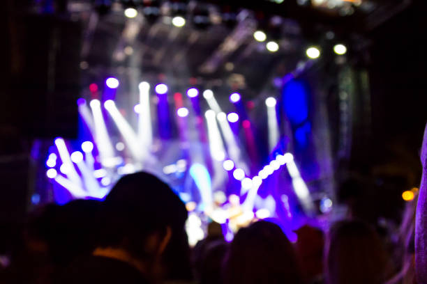 istock Concert arena with fans clapping 1165274333