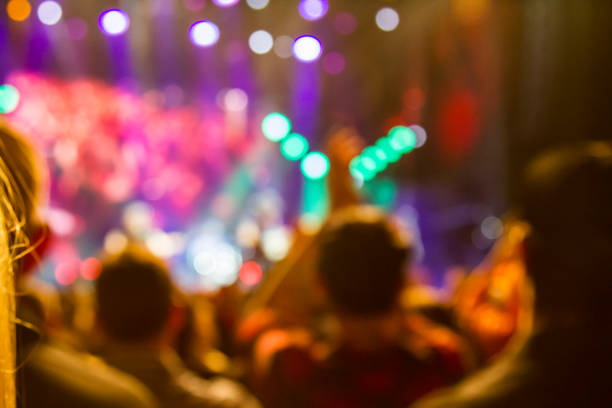 istock Concert arena with fans clapping 1165276013