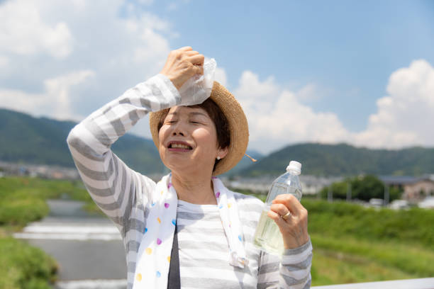 Senior woman preventing heatstroke