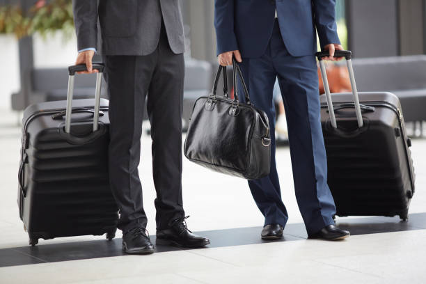 istock Businessmen with luggage 1165277239