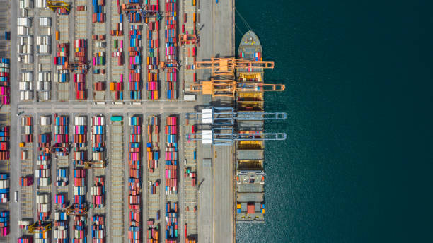 istock Aerial view cargo ship terminal, Unloading crane of cargo ship terminal, Aerial view industrial port with containers and container ship. 1165277862