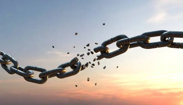 Chain that is torn at sunset