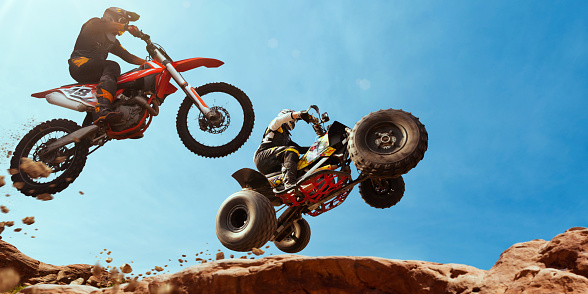 Quad bike rider in the action with motocross  rider.