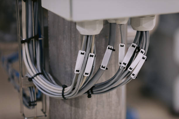 istock Electrical wires are connected to the control center. 1165281023