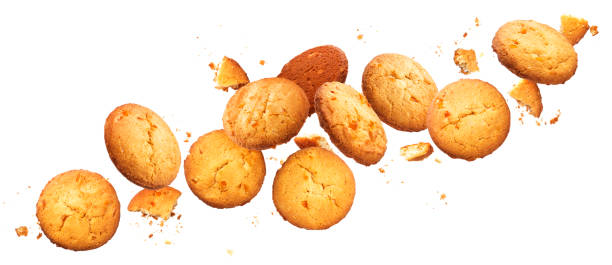 istock Falling broken chip cookies isolated on white background with clipping path 1165284260