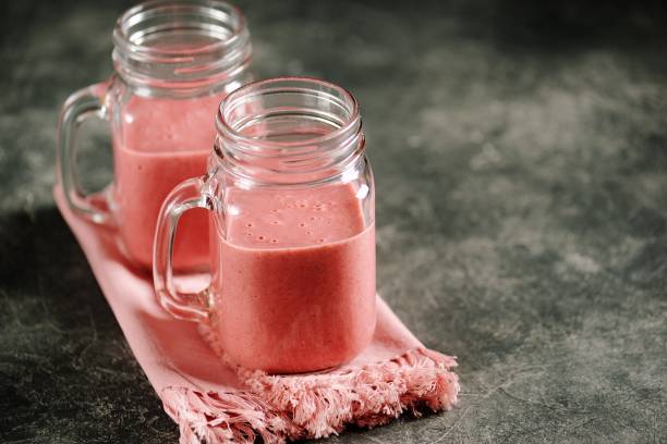 Berry smoothie with milk and oat bran. Healthy food. stock photo