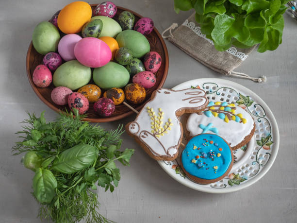 istock Easter treat on round plates with colorful eggs and gingerbread 1165288415