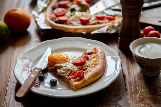 istock homemade pizza, with tomato,sausage and egg 1165288579