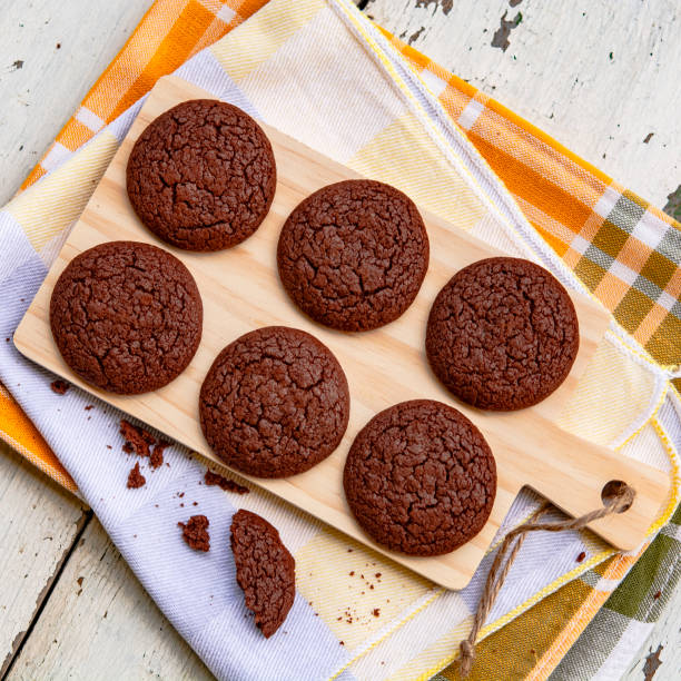 istock Chocolate cookies on a wooden table 1165288900