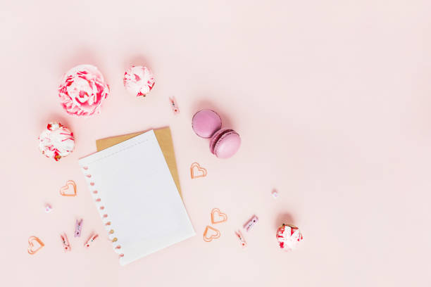 istock Card with peonies and macaroons with hearts. 1165288917