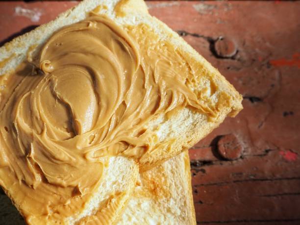 istock Breakfast of slice toast bread with peanut butter 1165291902