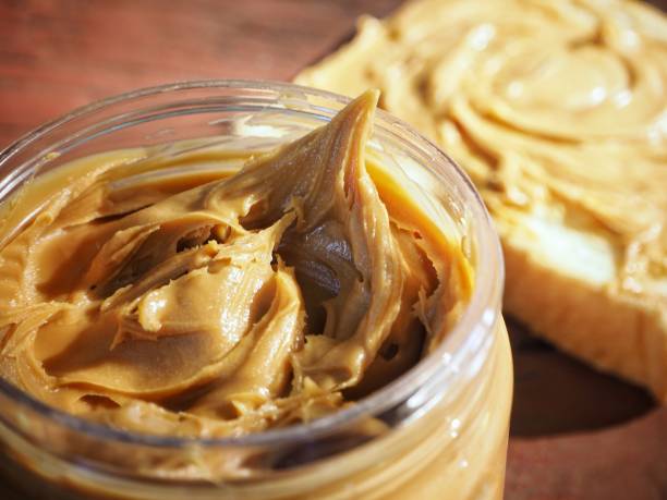 istock Breakfast of slice toast bread with peanut butter 1165291905