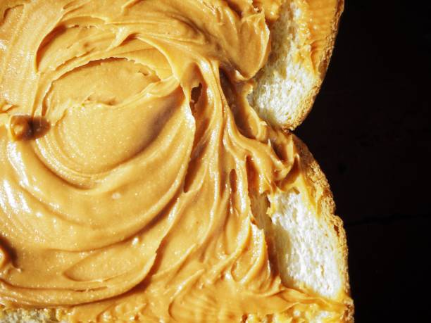 istock Breakfast of slice toast bread with peanut butter 1165291920