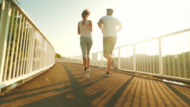 Couple jogging outdoors.