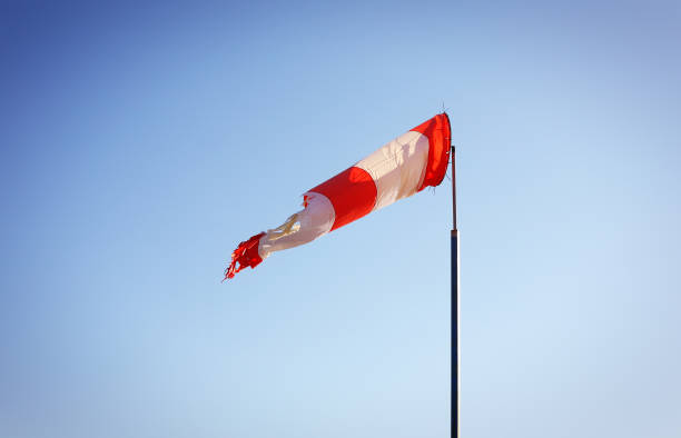istock Boats parking and aircraft - Wind direction indicator. East 1165292022