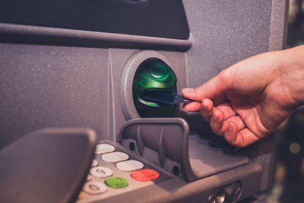 istock Close up of taking money from ATM. 1165298278