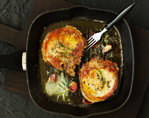 istock Fried pork steak with broccoli and onion sauce. 1165299887