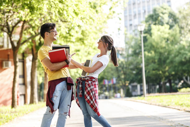 istock Young student couple going to college class. 1165300142