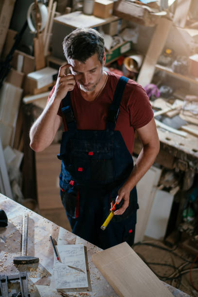 istock Young handsome carpenter stock photo 1165300165