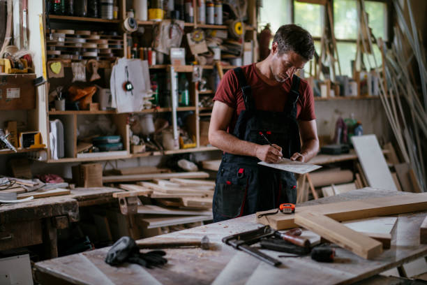 istock Young handsome carpenter stock photo 1165300246