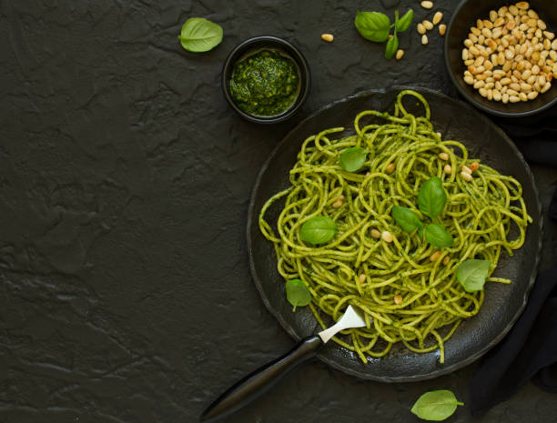 istock Spaghetti with pesto of arugula with pine nuts 1165300376
